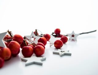 red cherries and white star decorations